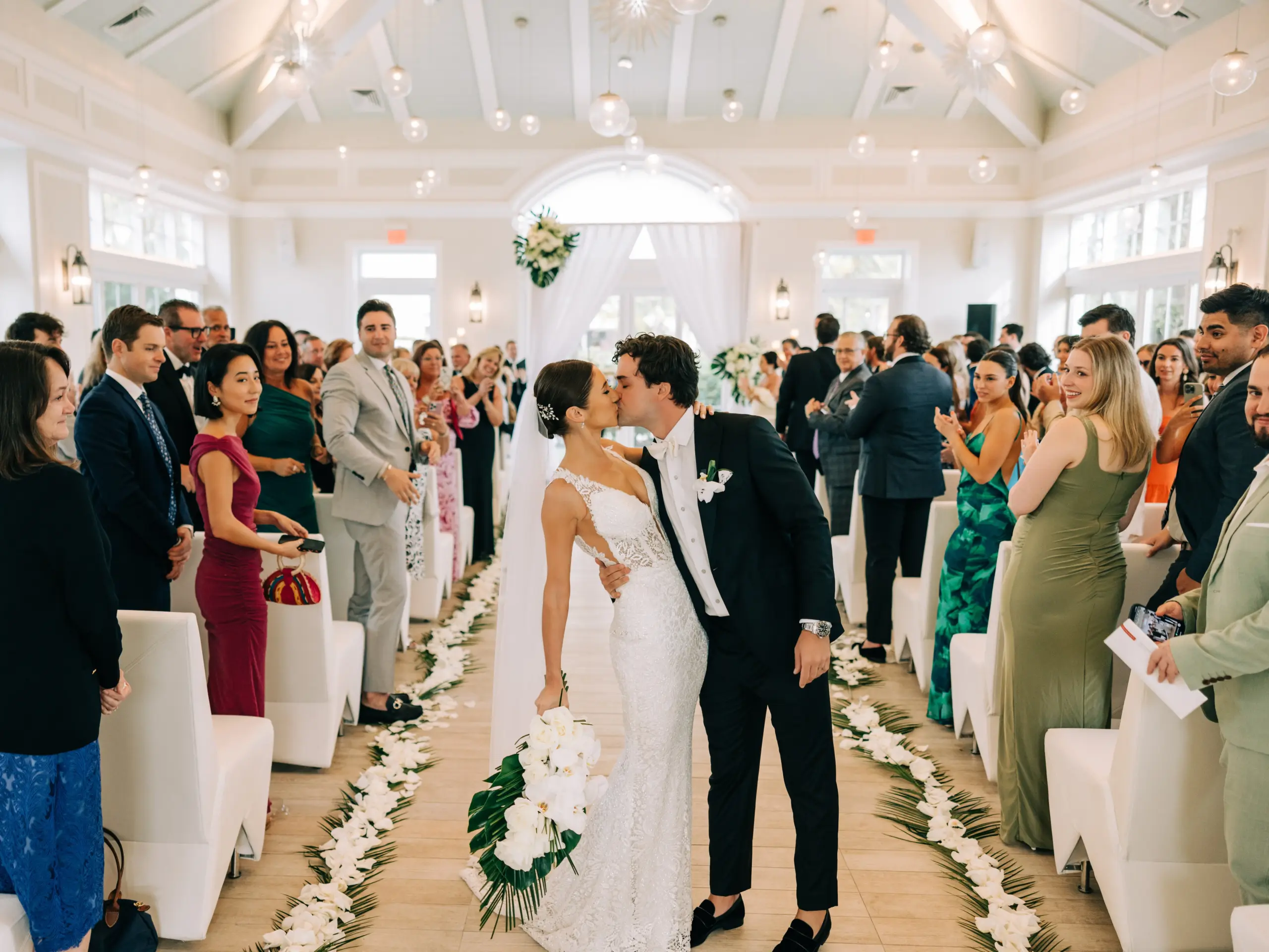A Bahamas wedding couple sharing a kiss together in the church after their wedding