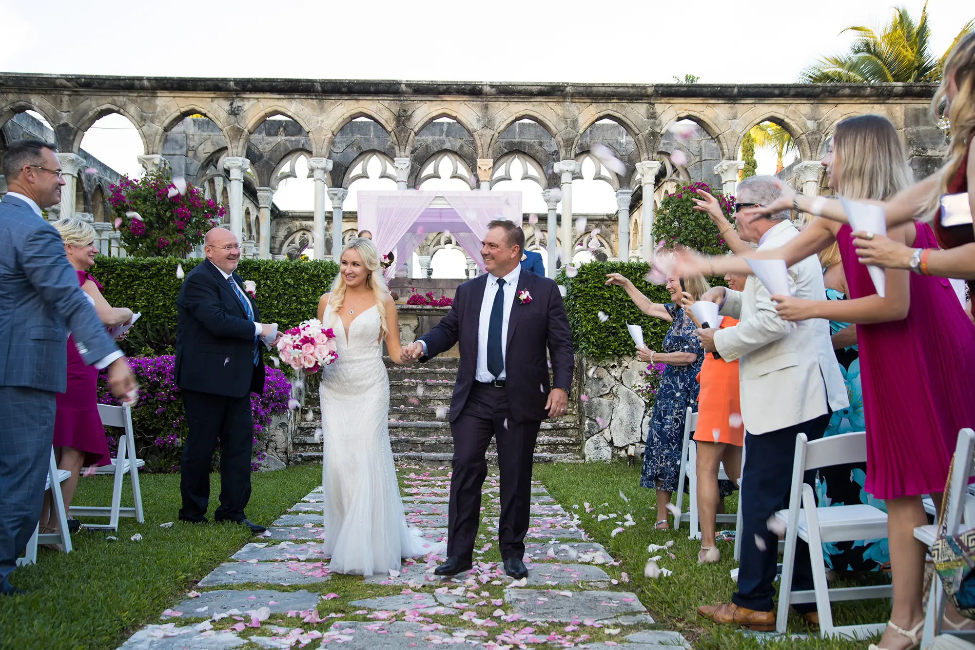 A wedding couple walking down the aisle